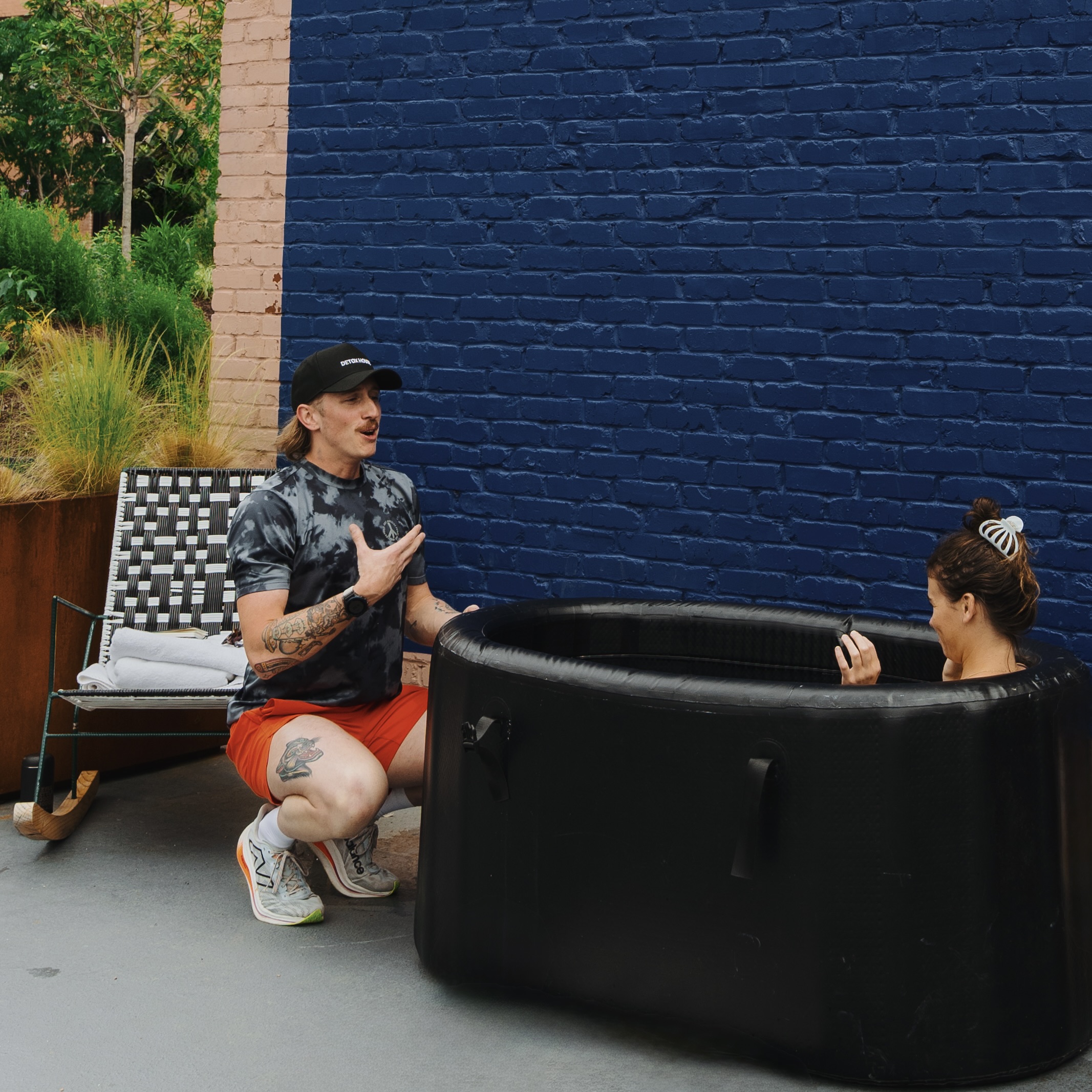 Brian coaching a participant during a cold plunge session